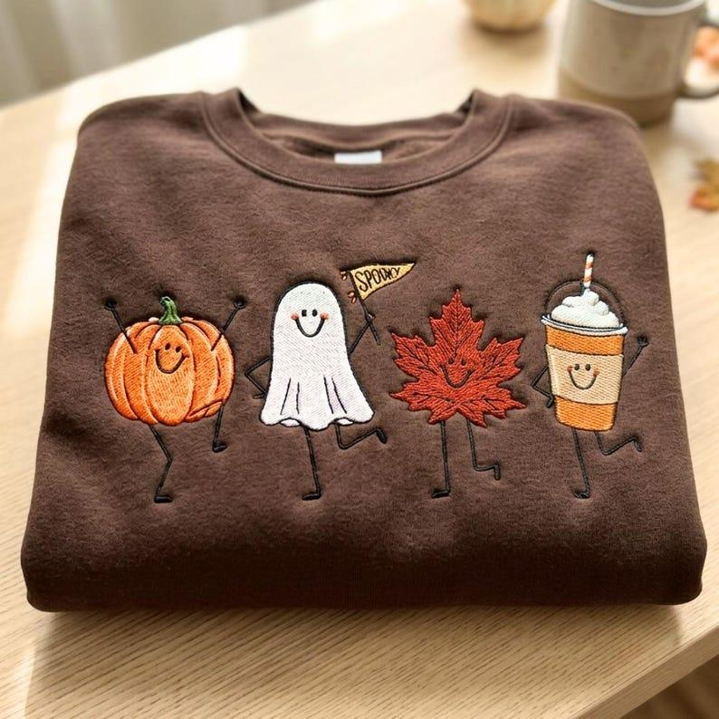 Cute Dancing Halloween Characters Embroidered T-Shirt Fall Leaf, Ghost & Iced Coffee Top