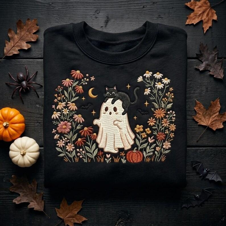 Embroidered Cat Lover Halloween T-Shirt, Cute Ghost and Black Cat Crewneck with Autumn Flowers, Pumpkin, Bats and Cozy Moon Design